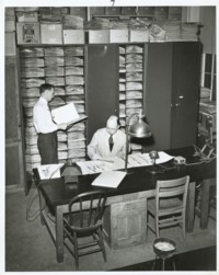 Photo: E. Moul and M.A. Johnson in the herbarium.